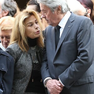 Nicole Calfan et Alain Delon - Obsèques de Pierre Mondy en l'église Saint-Honoré d'Eylau à Paris, le 20 septembre 2012.