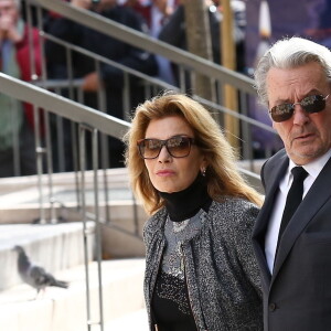 Nicole Calfan et Alain Delon - Obsèques de Pierre Mondy en l'église Saint-Honoré d'Eylau à Paris, le 20 septembre 2012.