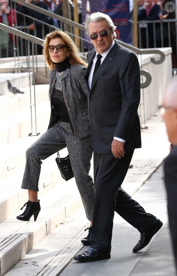 Nicole Calfan et Alain Delon - Obsèques de Pierre Mondy en l'église Saint-Honoré d'Eylau à Paris, le 20 septembre 2012.