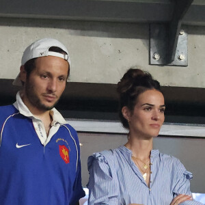 Le chanteur Vianney et sa femme Catherine Robert - People dans les tribunes lord du match d'ouverture de la Coupe du Monde de Rugby France 2023 avant le match de la Poule A entre la France et la Nouvelle-Zélande au Stade de France à Saint-Denis le 8 septembre 2023. © Dominique Jacovides/Bestimage 