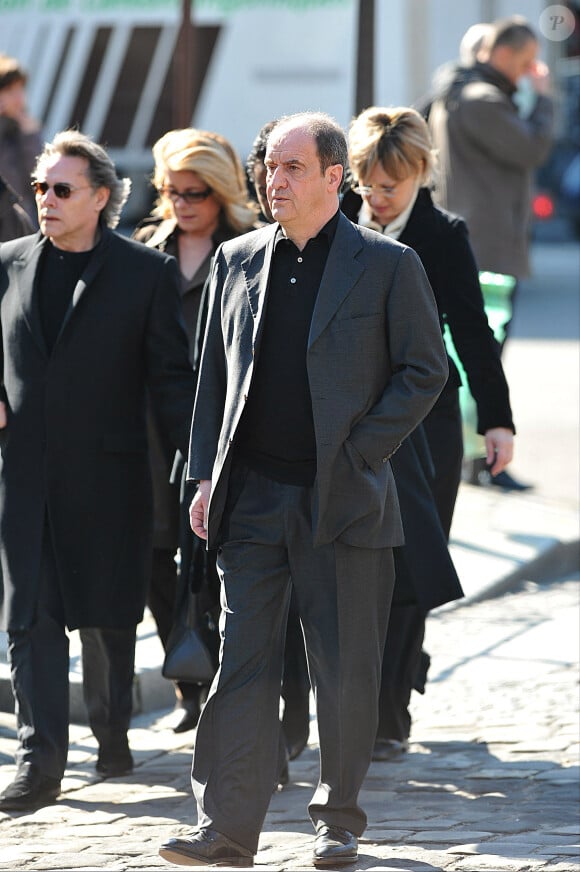 Yves Simon, Catherine Deneuve et Pierre Lescure arriving à la cérémonie d'adieu à Alain Bashung, le 20 mars 2009.