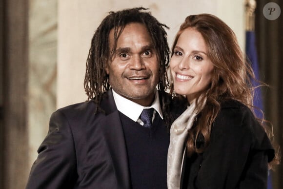 L'ancien footballeur français Christian Karembeu et sa femme Jacky Chamoun - Dîner au Palais de l'Elysée en l'honneur des 50 ans du Variétés Club de France, à Paris, le 14 octobre 2021. © Stéphane Lemouton / Bestimage