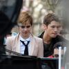 Emma Watson en plein tournage de la nouvelle pub pour Lancômedirigée par le photographe Mario Testino à Paris, le 15 mars 2011. Emma sort de la librairie Sheakspeare and Compagny près de la cathedrale Notre Dame.