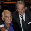 Jean-Paul Belmondo et Alain Delon lors de l'inauguration du Global Store Ermenegildo Zegna, à Paris, le 23 juin 2011.