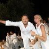 Henri Leconte et sa Florentine déchainés à la soirée blanche, aux Moulins de Ramatuelle, le 10 juillet 2011.