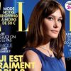 Un an et demi après son mariage au président Nicolas Sarkozy, Carla Bruni-Sarkozy réalise la couverture du magazine Elle. 18 septembre 2009.