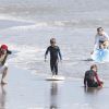 David Beckham et ses trois fils en pleine séance de surf, août 2011