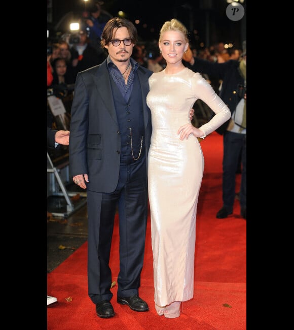 Johnny Depp et Amber Heard pour présenter Rhum Express à Londres, le 3 novembre 2011.
