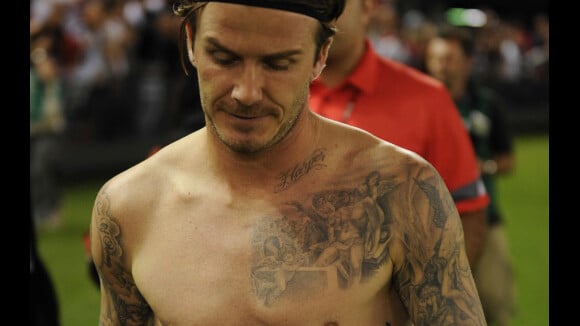David Beckham affiche ses poignées d'amour et rêve de Jeux Olympiques
