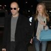 Rosie Huntington Whiteley et Jason Statham arrivent à l'aéroport de Los Angeles, le 13 décembre 2011.