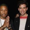 Pharrell Williams et le chanteur Mika à la soirée Lanvin pour marquer les 10 ans d'Alber Elbaz à la tête de la direction artistique de la maison, en marge du défilé. Le 2 mars 2012