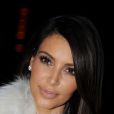 Kim Kardashian au sommet de son art à la Halle Freyssinet pour le défilé Kanye West. Paris, le 6 mars 2012.