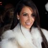 Kim Kardashian, sublime avec son épaisse écharpe en fourrure à la Halle Freyssinet lors du défilé Kanye West. Paris, le 6 mars 2012.
