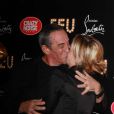 Thierry Ardisson et Audrey Crespo-Mara s'embrassent à la première VIP de la revue  Feu  au Crazy Horse, à Paris, le 12 mars 2012.