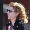 Emma Roberts court après un taxi dans les rues de New York le 27 mars 2012 