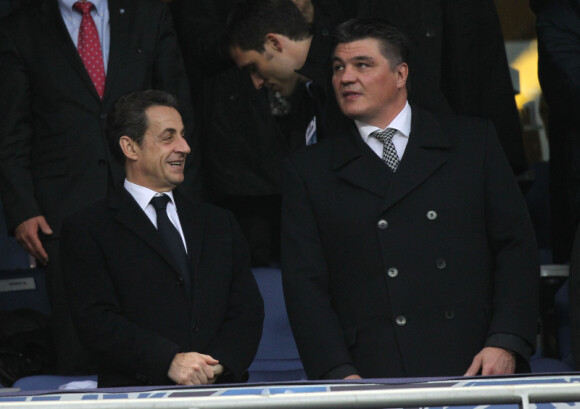 Nicolas Sarkozy et David Douillet assistent au match opposant l'Olympique Lyonnais à Quevilly, en finale de la Coupe de France, le samedi 28 avril 2012 au Stade de France, près de Paris.