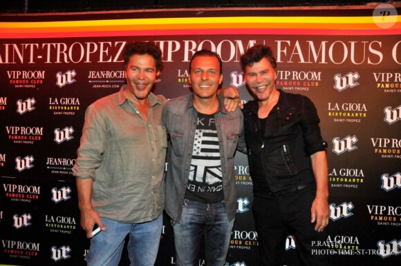 Igor et Grichka Bogdanoff posent en compagnie de Jean-Roch au VIP Room de St-Tropez, le mercredi 15 août 2012.
