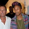 Patrick Tartary accueille Pharrell Williams au Gotha Club à Cannes, le 23 août 2012.