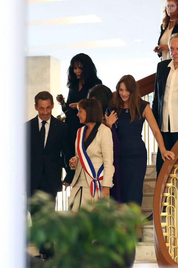 Yamina Benguigui, Carla Bruni-Sarkozy et Nicolas Sarkozy au mariage de Farida Khelfa et Henri Seydoux, à la mairie du 17arrondissement de Paris, le 1er septembre 2012.