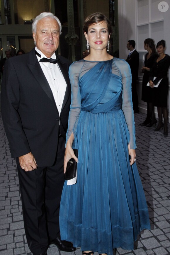 Bernard Fornas, le président de Cartier, et Charlotte Casiraghi lors de l'inauguration de la 26e Biennale des antiquaires au Grand Palais à Paris le 12 septembre 2012