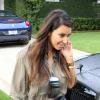 Kim Kardashian, très chic comme toujours, sort le grand jeu pour retrouver son chéri Kanye West à Miami. Le 8 octobre 2012.