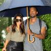 Kim Kardashian et Kanye West, amoureux sous la pluie à Miami. Le 8 octobre 2012.