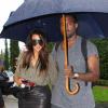 Kim Kardashian et Kanye West, amoureux sous la pluie à Miami. Le 8 octobre 2012.