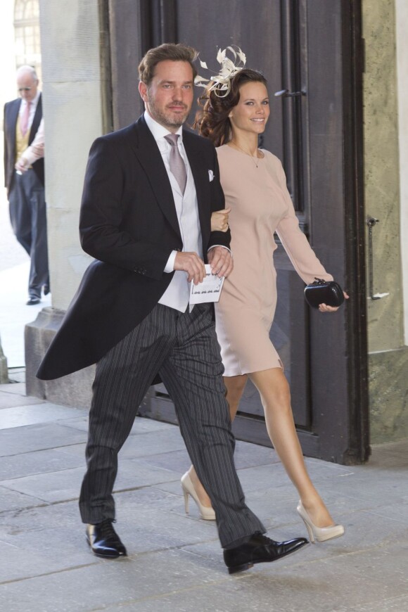Christopher O'Neill, fiancé de la princesse Madeleine de Suède, lors du baptême de la princesse Estelle le 22 mai 2012, au côté de Sofia Hellqvist, compagne du prince Carl Philip.
