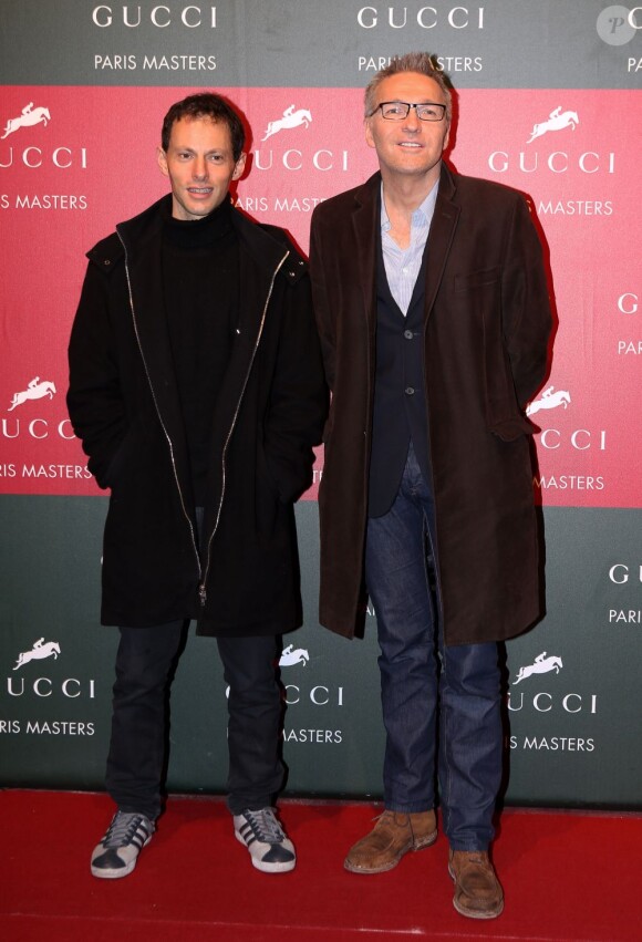 Marc Olivier Fogiel et Laurent Ruquier au Gucci Paris Masters le 2 décembre 2012 pour le Grand Prix, remporté par le Néerlandais Mark Houtzager avec Sterrehof's Tamino.