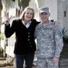 Exclusif - De bonne humeur, Sharon Stone fait le bonheur d'un G.I. en uniforme en posant à ses côtés. Beverly Hills, le 21 décembre 2012.