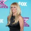 Britney Spears pose à la conférence de presse pour la dernière saison de l'émission X Factor à Los Angeles, le 17 décembre 2012.