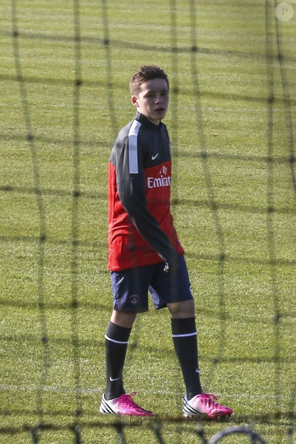 Brooklyn Beckham s'entraîne au Camp des Loges, le 19 février 2013.