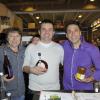Trois des participants de l'émission L'amour est dans le pré 7 (Patrice, Philippe et Pierre) vendent des produits régionaux au Salon de l'Agriculture à Paris, le 27 février 2013