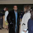 Kanye West et Carine Roitfeld en pleine discussion lors du défilé Céline au Tennis Club de Paris. Paris, le 3 mars 2013.