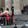 Funérailles de Margaret Thatcher, célébrées le 17 avril 2013 en la cathédrale St Paul de Londres. Son fils Mark, avec son épouse Sarah et leurs enfants Michael et Amanda, sa fille Carol, avec son compagnon Marco Grass, se sont montrés recueillis et soudés sur le parvis de la cathédrale Saint Paul lors de l'arrivée du cercueil.