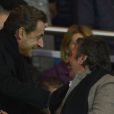 Nicolas Sarkozy et Richard Anconina lors du match PSG-Nice (3-0) au Parc des Princes le 21 avril 2013.