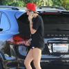 Exclusif - Miley Cyrus, sexy en t-shirt Diamond Supply & Co., mini-short et souliers Saint Laurent pour faire le plein de son 4x4 Porsche Cayenne. Los Angeles, le 30 avril 2013.