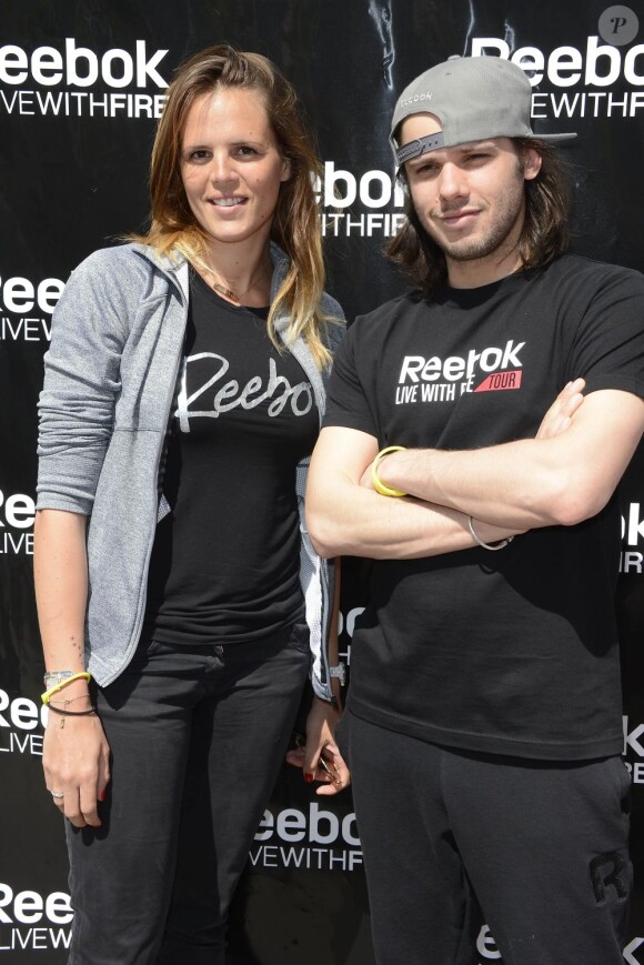 Laure Manaudou et Orelsan lors du lancement du "Reebok Live With Fire Tour" à Paris le 4 mai 2013.