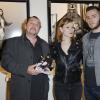 Exclu - Pierre Terrasson, accompagné de sa fille, au vernissage de son exposition "Vanessa Paradis - Les Années Lolita" à la Galerie Sparts à Paris le 14 mai 2013.