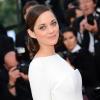 Marion Cotillard resplendissante en Dior lors de la montée des marches du film "The Immigrant" lors du 66e festival du film de Cannes, le 24 mai 2013