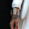 Rihanna accessoirise sa tenue de bijoux et de broches Chanel. Paris, le 4 juin 2013.
