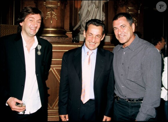 Pierre Palmade, Nicolas Sarkozy, et Jean-Marie Bigard à Paris le 14 septembre 2004. 