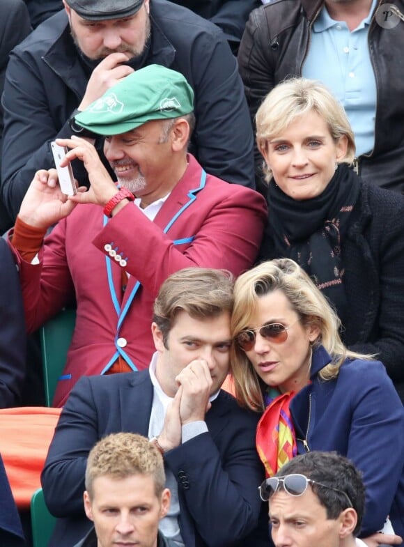 Christian Louboutin et Melita Toscan du Plantier, Laurence Ferrari et son mari Renaud Capucon - finale opposant Rafael Nadal à David Ferrer au tournoi de Roland-Garros, à Paris le 9 juin 2013.  