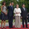 Michelle Obama, Barack Obama, Angela Merkel et son mari Joachim Sauer prennent la pose ensemble avant le dîner officiel organisé au palace Charlottenburg à Berlin, le 19 juin 2013.