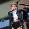 Will.i.am et  Miley Cyrus en concert sur le plateau du Jimmy Kimmel Live, à Hollywood, le 25 Juin 2013.