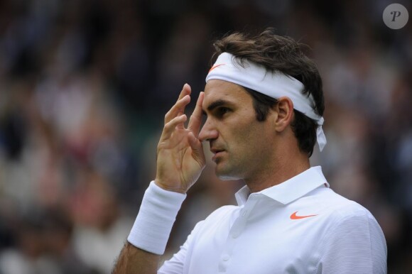 Roger Federer lors de son entrée à Wimbledon à Londres le 24 juin 2013.