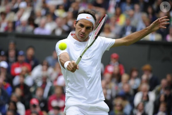 Roger Federer lors de son entrée à Wimbledon à Londres le 24 juin 2013.