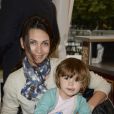 Adeline Blondieau et sa fille Wilona lors de l'inauguration de la fête foraine des Tuileries à Paris le 28 juin 2013