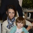 Adeline Blondieau et sa fille Wilona lors de l'inauguration de la fête foraine des Tuileries à Paris le 28 juin 2013