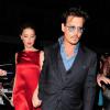 Johnny Depp croisé avec la belle Amber Heard, robe rouge satin, au C Restaurant à Londres le 21 juillet 2013.